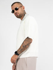 Polo mezza zip borchie
